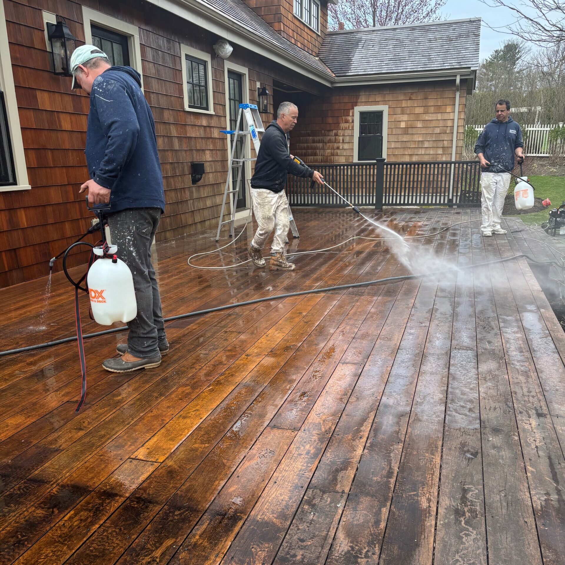 Power washing a deck in Milton, MA